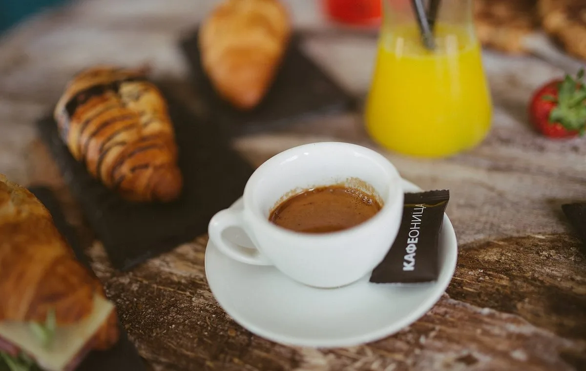 Breakfast table with coffee and pastries